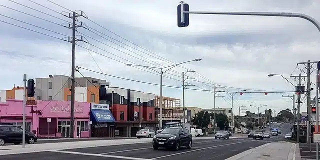 Forecourt of Ormond Railway Station featuring a modern design with a paved area, seating, and landscaping, located in Melbourne, Australia.