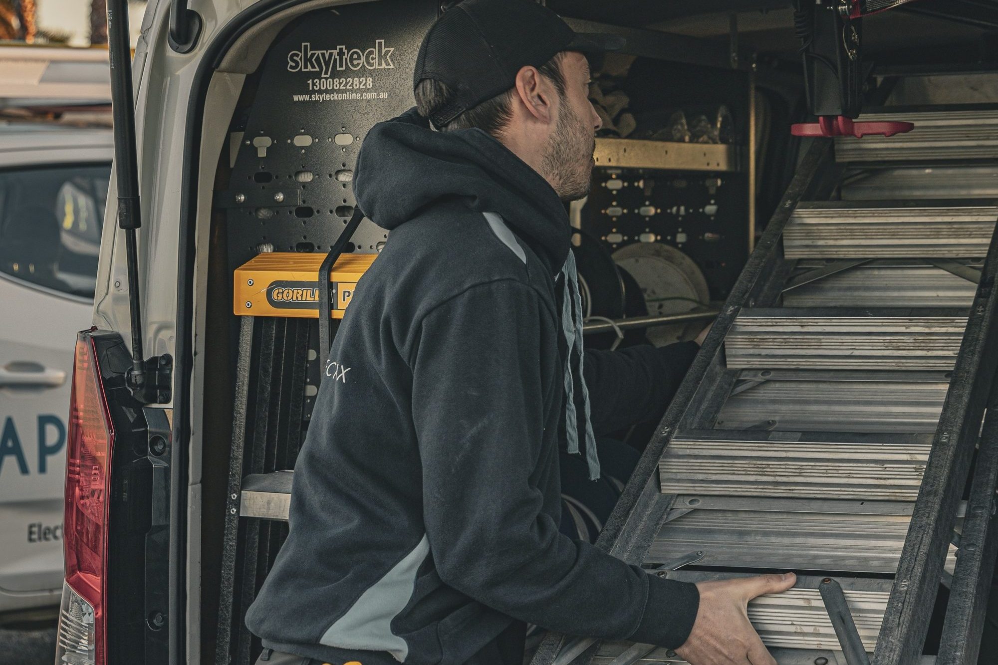 Approved Electrix Team Person with Ladder in Van