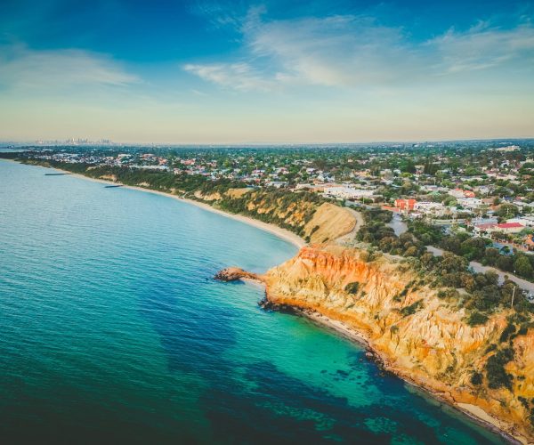 Aerial view of Black Rock, showcasing the coastline of Melbourne, Australia, with waves lapping against the shore.