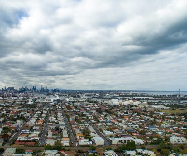 Aerial view of Yarraville's city skyline, showcasing buildings and urban landscape against a clear blue sky.
