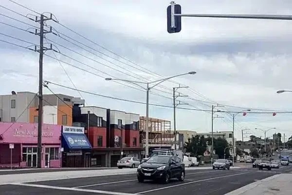 Forecourt of Ormond Railway Station featuring a modern design with a paved area, seating, and landscaping, located in Melbourne, Australia.