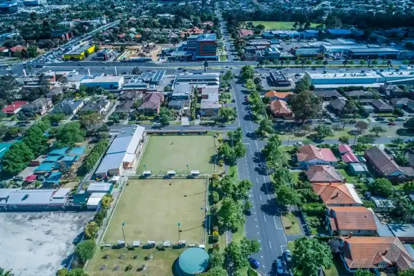Aerial view of Oakleigh with residential properties, bowling green, and tree-lined streets.
