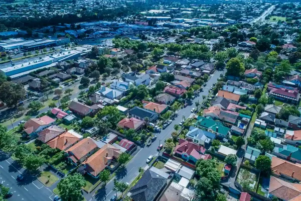 Suburban Oakleigh neighborhood with colorful rooftops and green streets.