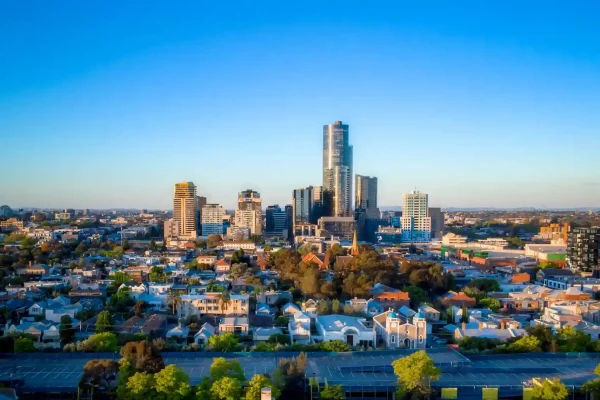Aerial view of Prahran showcasing a mix of residential and commercial buildings under a clear blue sky.